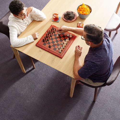 people playing chess from McBride Wayside Carpet Co. in Newington