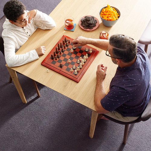 People playing chess from McBride Wayside Carpet Co. in Newington